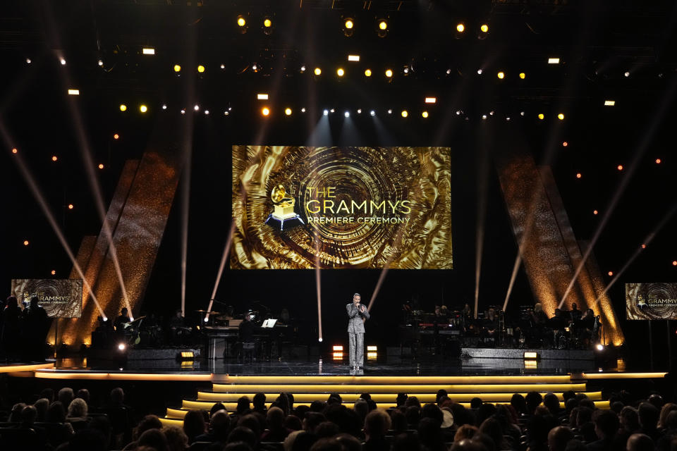 Presenter Justin Tranter appears on stage during the 66th annual Grammy Awards on Sunday, Feb. 4, 2024, in Los Angeles. (AP Photo/Chris Pizzello)