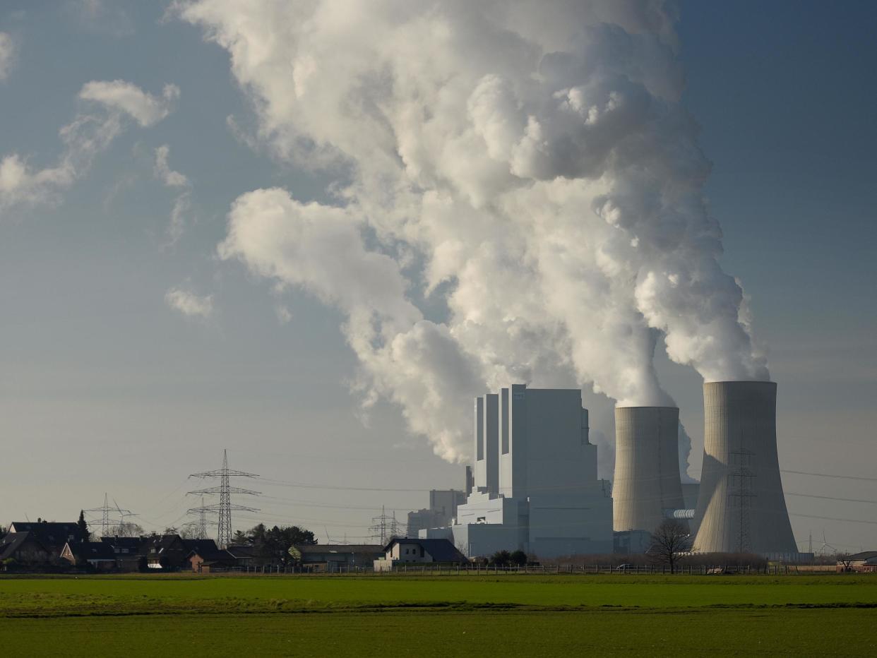 Steam rises from cooling towers of a coal-fired power plant: Getty Images