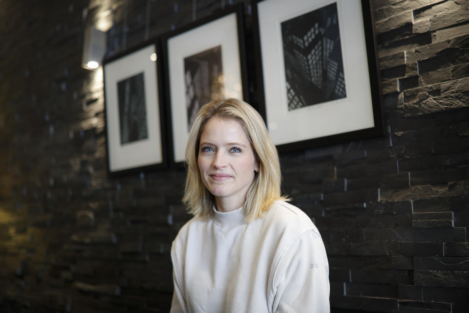 Television host and journalist Sara Haines is photographed in her lobby after working from home due to COVID-19 concerns, April 6, 2020, in the Brooklyn borough of New York. Haines isn't afraid to tackle serious subjects and has done so often as a co-host on "The View." Monday felt different. Confined to her home, she broadcast a segment from her living room couch about grief, compassion and loneliness. (AP Photo/John Minchillo)