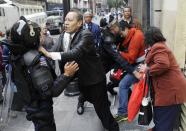 People confront riot policemen who are trying to arrest a protester in downtown Mexico City September 13, 2013. (REUTERS/Henry Romero)