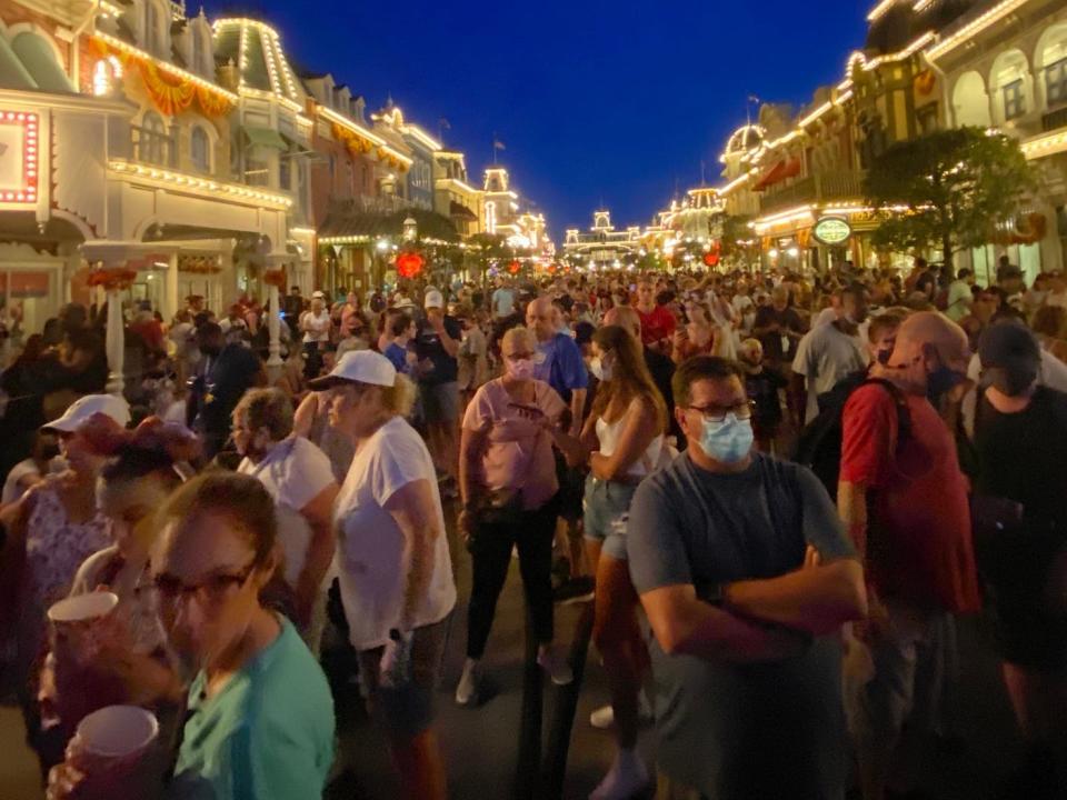 Crowds gather to watch fireworks at Magic Kingdom in August 2021.