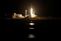 A SpaceX Falcon 9 rocket, with the Crew Dragon capsule, carrying four astronauts on a NASA commercial crew mission, launches at the Kennedy Space Center