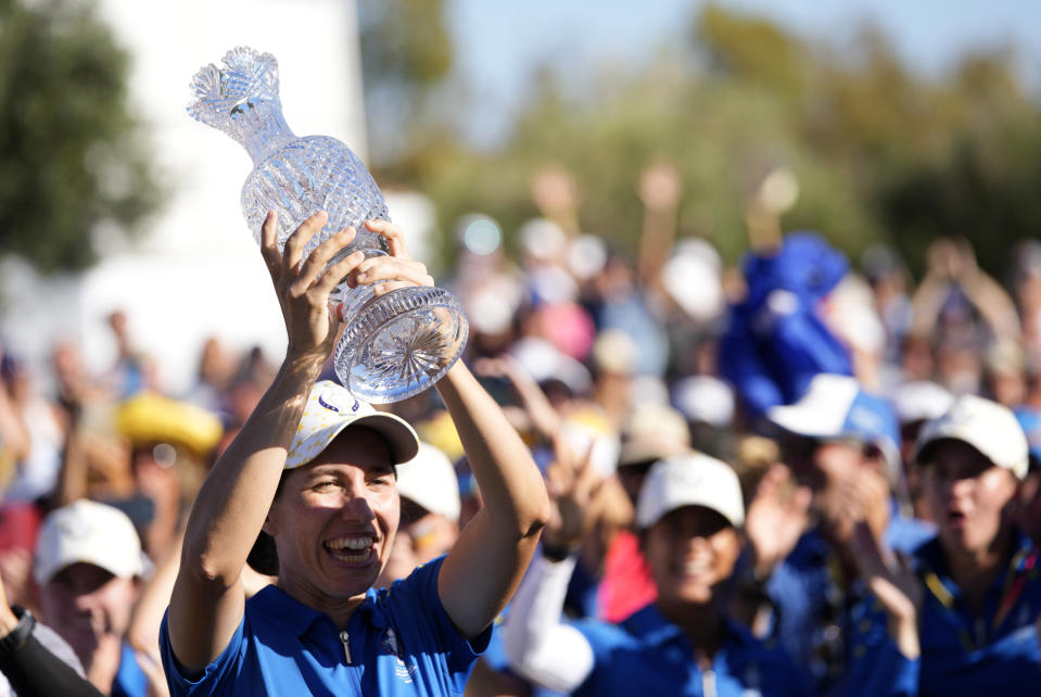 Europe's Carlota Ciganda lifts the trophy after wining the Solheim Cup golf tournament in Finca Cortesin, near Casares, southern Spain, Sunday, Sept. 24, 2023. Europe has beaten the United States during this biannual women's golf tournament, which played alternately in Europe and the United States. (AP Photo/Bernat Armangue)