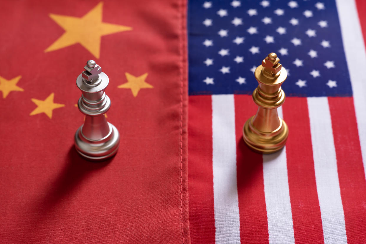  Chess pieces on Chinese and US flag. 