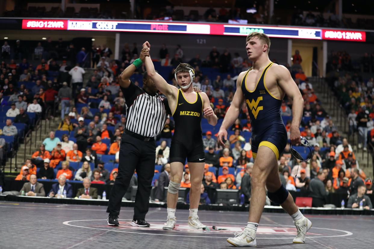 Missouri's Keegan O'Toole has his arm raised after winning the 165-pound championship Sunday at the Big 12 Conference Tournament in Tulsa, Okla.