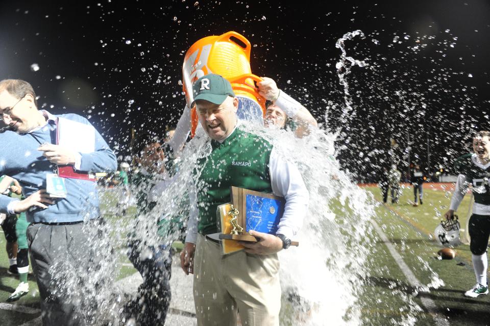 From 2012: Ramapo head coach Drew Gibbs get doused by water after an amazing second half comeback to defeat Sparta 37-34 Saturday at Kean University for the North 1 Group 3 title.