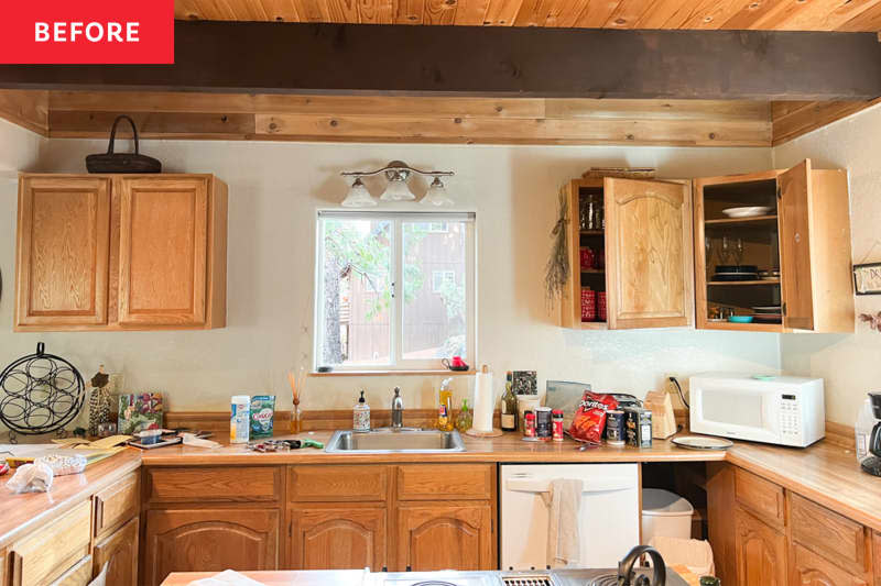 Wood cabinets in kitchen before renovation.