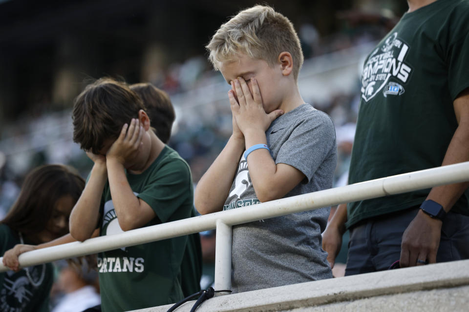 Young Michigan State fans react after an interception during the second half of an NCAA college football game against Maryland, Saturday, Sept. 23, 2023, in East Lansing, Mich. (AP Photo/Al Goldis)