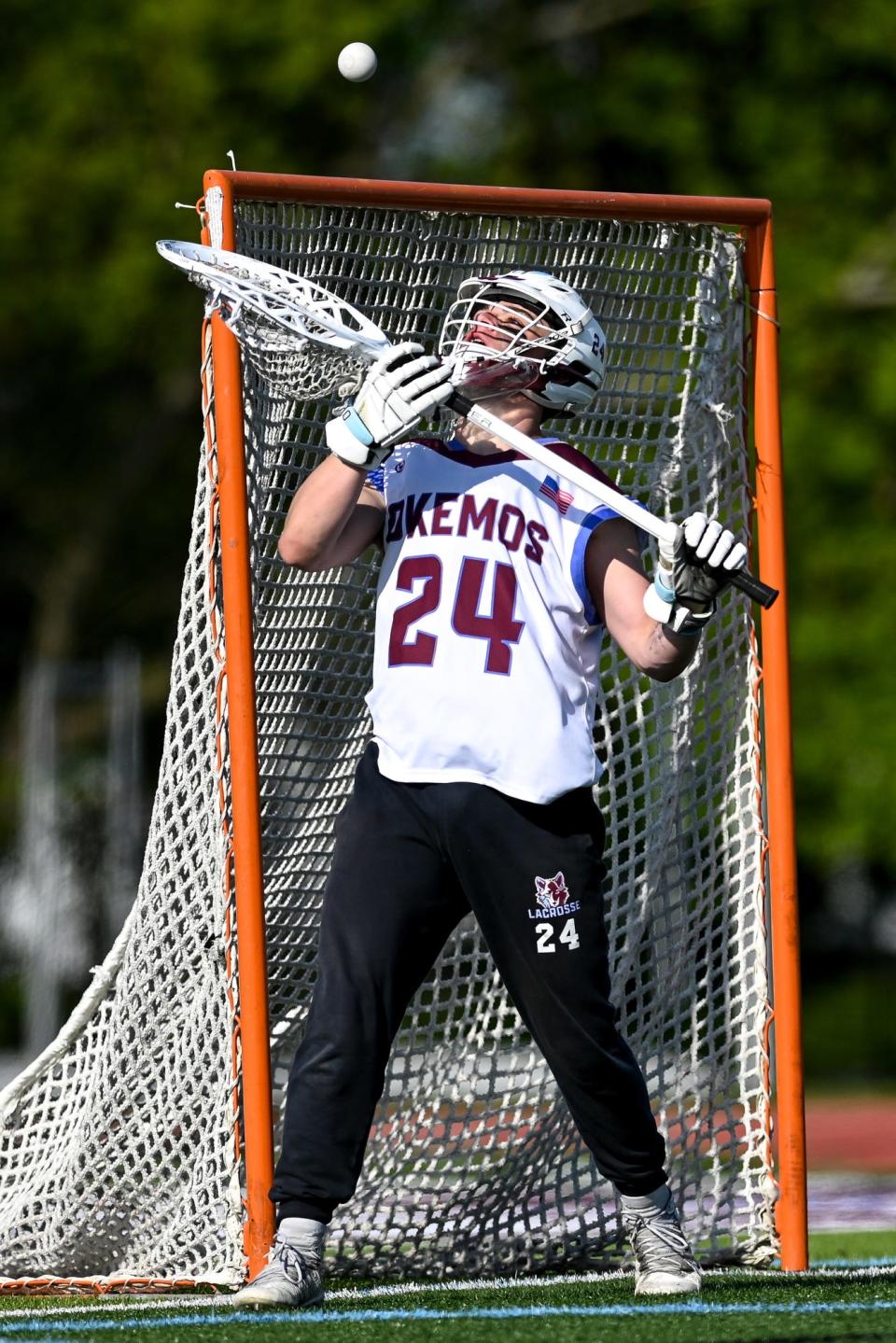 Okemos' goalie Frankie Ahearn makes a stop against Haslett-Williamston during the second half on Tuesday, May 9, 2023, at Okemos High School.