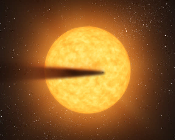 This artist's concept depicts a cometlike tail of a possible disintegrating super Mercury-size planet candidate as it transits, or crosses, its parent star, named KIC 12557548. At an orbital distance of only twice the diameter of its star, the