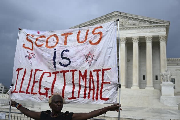 People rally outside the U.S. Supreme Court on June 29 to protest recent decisions to strike down a student loan forgiveness plan and bar race-conscious student admissions programs.