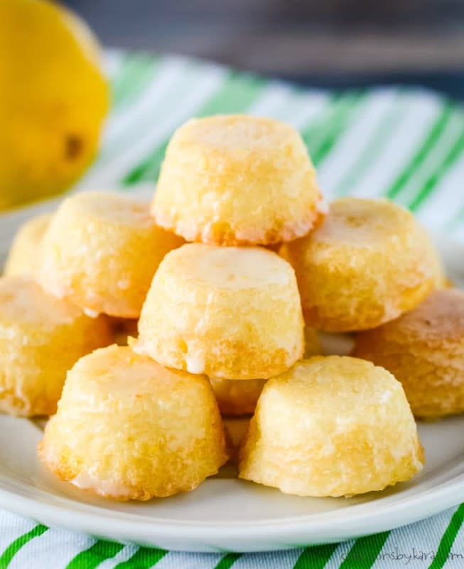 <p>Creations by Kara</p><p>These bite sized lemon treats are covered with a delicious lemon glaze, and they practically melt in your mouth!</p><p><strong>Get the recipe: <a href="https://www.creationsbykara.com/from-scratch-mini-lemon-drop-cakes/" rel="nofollow noopener" target="_blank" data-ylk="slk:Mini Lemon Drop Cakes;elm:context_link;itc:0;sec:content-canvas" class="link rapid-noclick-resp">Mini Lemon Drop Cakes</a></strong></p>