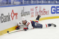 Washington Capitals forward Tom Wilson (43) falls during the first period of an NHL hockey game against the Buffalo Sabres, Friday, Jan. 15, 2021, in Buffalo, N.Y. (AP Photo/Jeffrey T. Barnes)