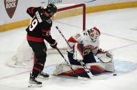 Ottawa Senators right wing Drake Batherson (19) pressures Florida Panthers goaltender Sergei Bobrovsky who makes a save during first-period NHL hockey game action Monday, March 27, 2023, in Ottawa, Ontario. (Adrian Wyld/The Canadian Press via AP)