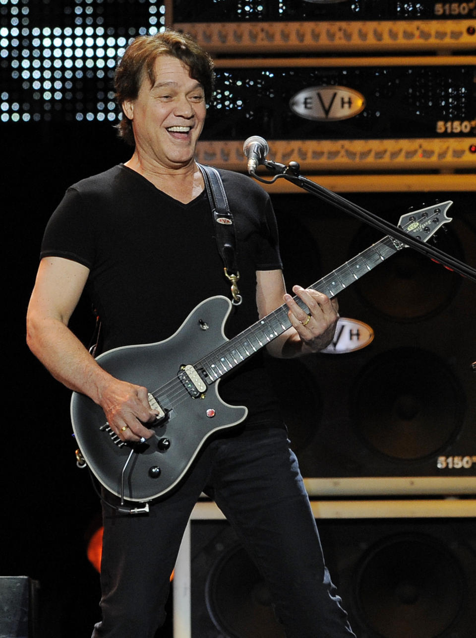 FILE - This June 1, 2012 file photo shows guitarist Eddie Van Halen of the band Van Halen performing in Los Angeles. Van Halen, who had battled cancer, died Tuesday, Oct. 6, 2020. He was 65. (Photo by Chris Pizzello/Invision/AP, file)