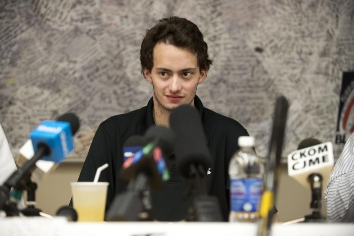 Kootenay Ice forward and Montreal Canadiens prospect Tim Bozon speaks to media regarding his expected release from a Saskatoon hospital after falling ill with meningitis at the beginning of March, in Saskatoon, Saskatchewan, on Friday, March 28, 2014. (AP Photo/The Canadian Press, Liam Richards)