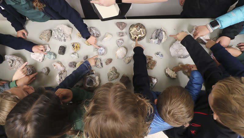 J.E. Cosgriff Memorial Catholic School students look over pieces of quartz during Earth Science Week at the Utah Geological Survey’s Core Research Center in Salt Lake City on Oct. 9, 2019.