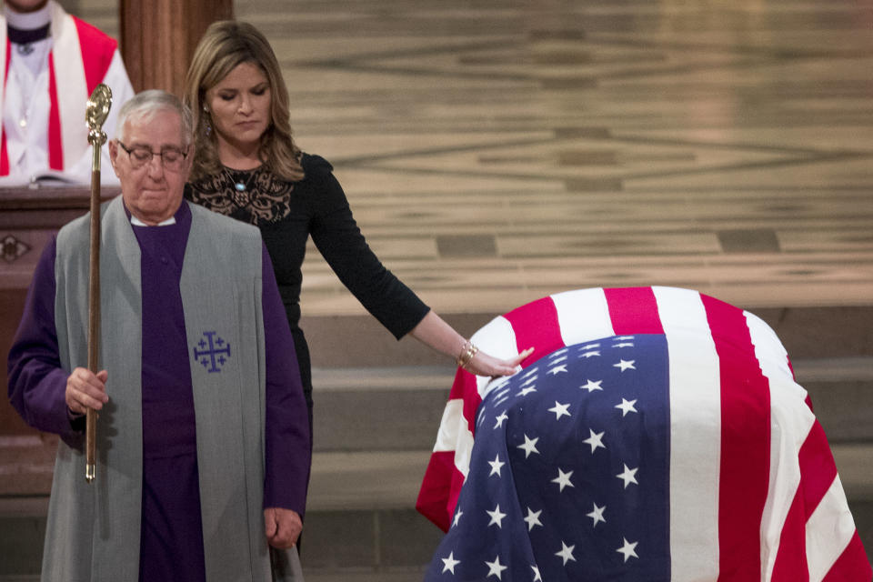 Jenna Bush Hager, the daughter of former President George Bush, touches the casket of former President George H.W. Bush after speaking at his State Funeral.