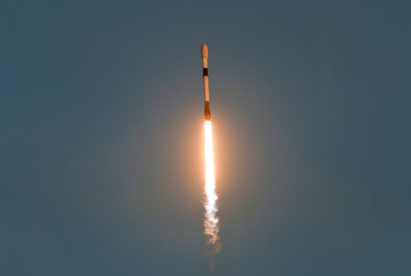 FILE PHOTO: A SpaceX Falcon 9 rocket lifts off with a payload of 21 Starlink satellites from the Cape Canaveral Space Force Station