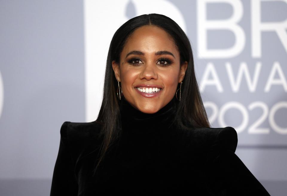 Footballer Alex Scott poses for photographers upon arrival at Brit Awards 2020 in London, Tuesday, Feb. 18, 2020.(Photo by Vianney Le Caer/Invision/AP)