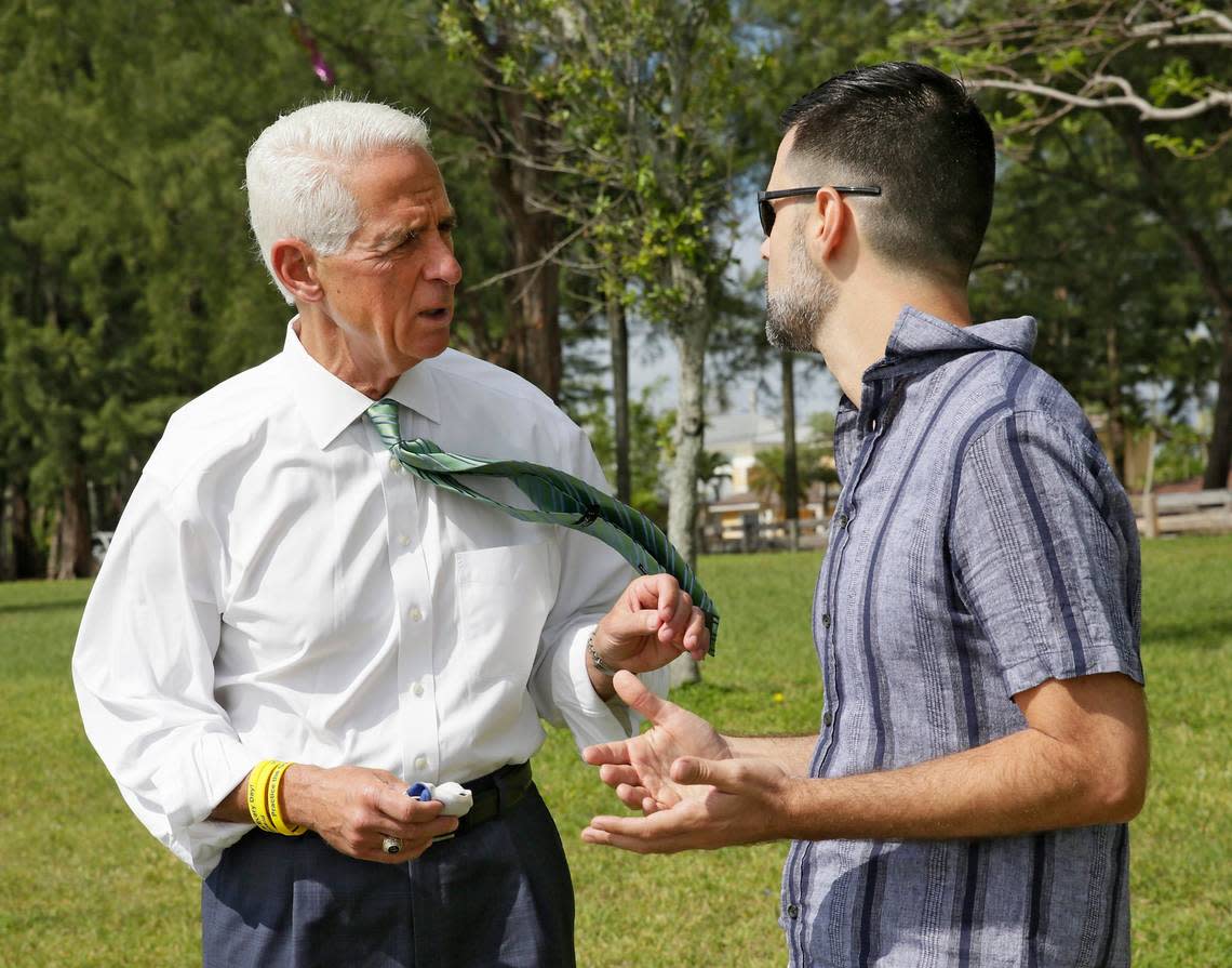 In this file photo from May 8, 2021, then-Democratic candidate for Florida governor Charlie Crist talks to Horacio Sierra, Cuban American Democratic Club president, during his meeting with Miami-Dade Democratic Cuban Americans at Tropical Park in Miami