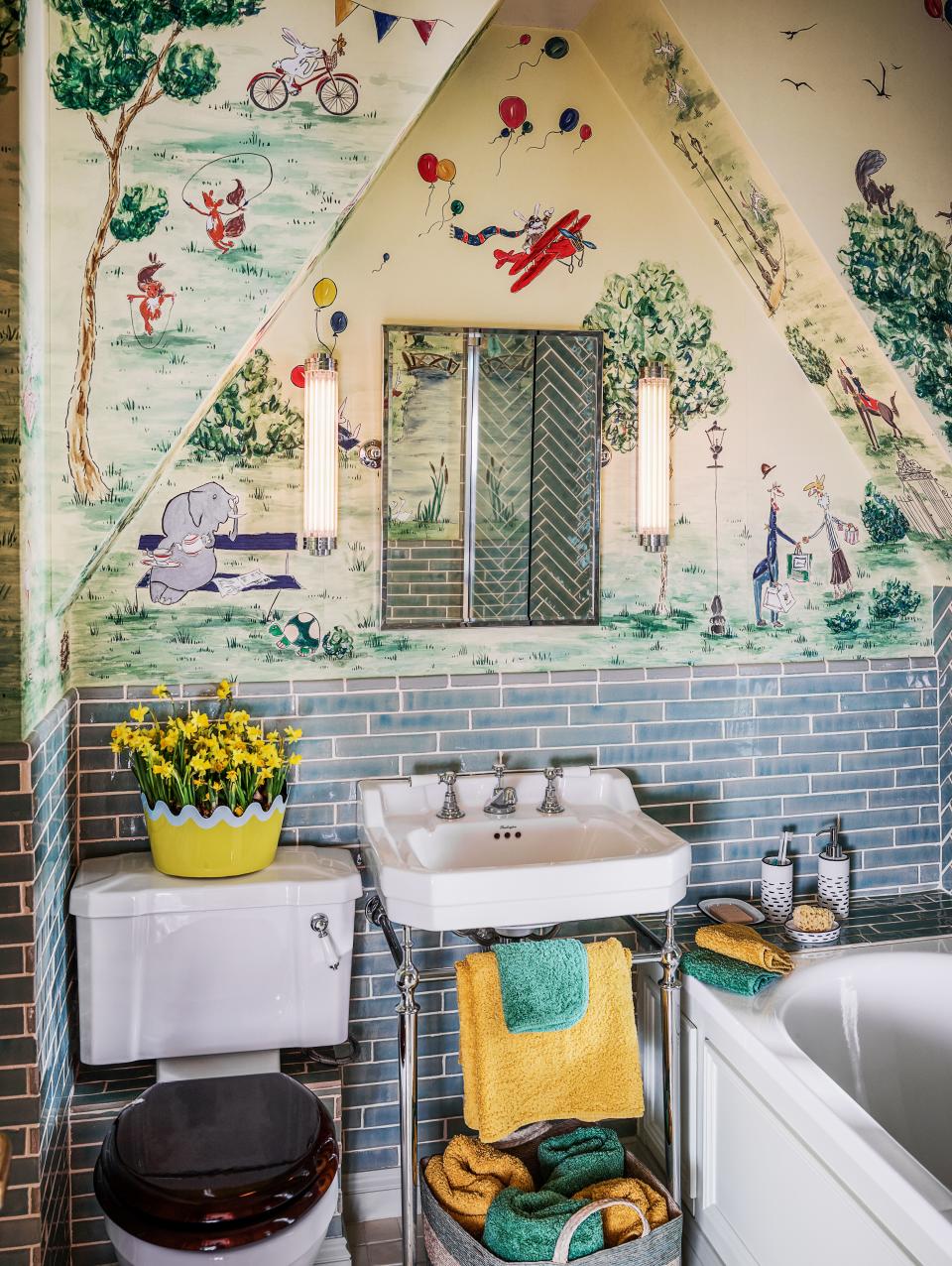 Collier Webb sconces illuminate the children’s bath. Matilda Goad scalloped planter; Burlington sink; Lefroy Brooks fittings.