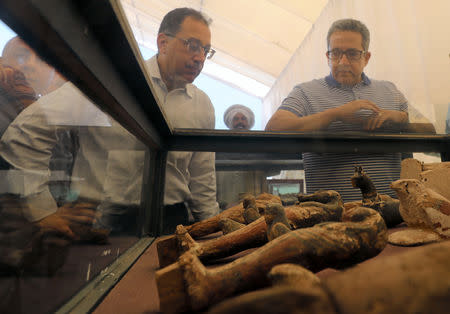 Egyptian Prime Minister Mostafa Madbouly and Minister of Antiquities Khaled El-Anany inspecting newly discovered artifacts on display outside "Shedsu Djehuty" tomb in Luxor, Egypt April 18, 2019. REUTERS/Mohamed Abd El Ghany