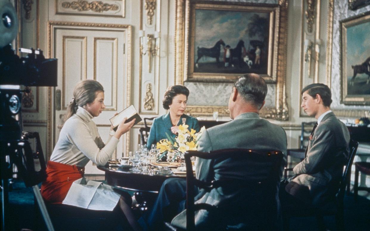 Queen Elizabeth II lunches with Prince Philip and their children Princess Anne and Prince Charles at Windsor Castle in Berkshire, circa 1969 - Hulton Archive