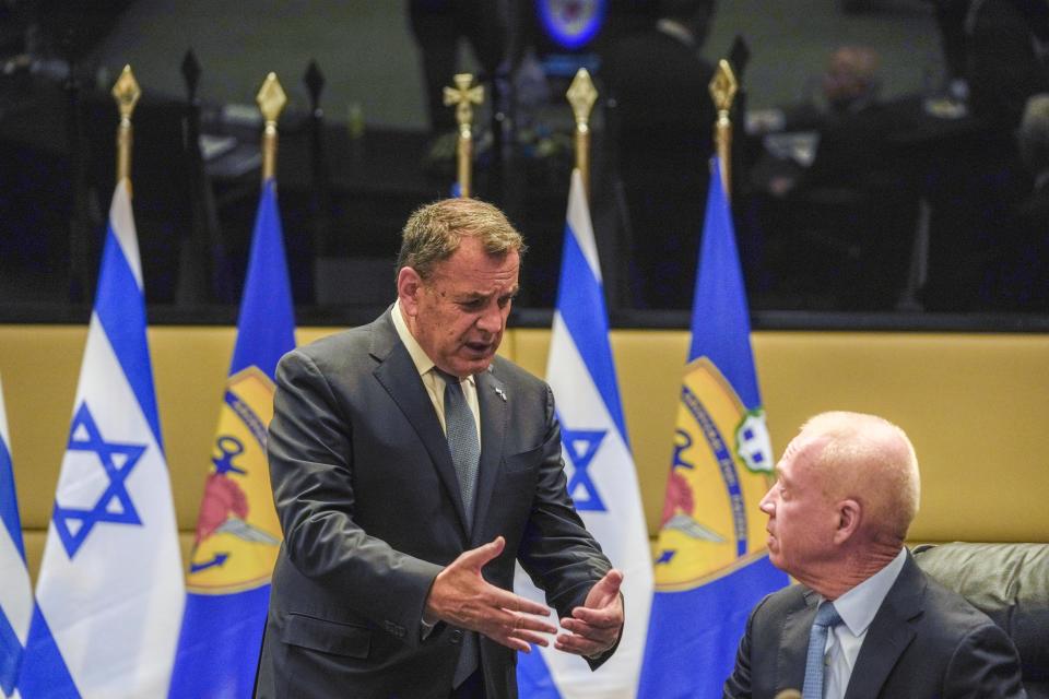 Greek Defence Minister Nikos Panagiotopoulos, left, speaks with his Israeli counterpart Yoav Galand during their meeting in Athens, Thursday, May 4, 2023. Galand is in Greece on an official visit. (AP Photo/Thanassis Stavrakis)