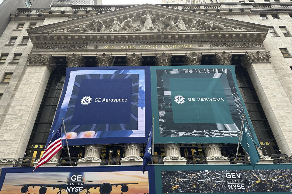 General Electric banners hangs on the facade of New York Stock Exchange Tuesday, April 2, 2024 in New York. General Electric has completed its split of the one-time conglomerate into three separate companies, as its aerospace and energy businesses prepare to start trading on the New York Stock Exchange as separate entities. (AP Photo/Peter Morgan)