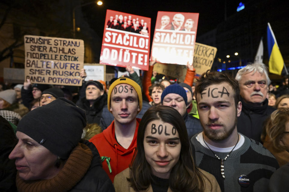 People gather to take part in a protest against a government plan to amend the penal code in Bratislava, Slovakia, on Thursday, Jan. 25, 2024. The changes proposed by the three-party coalition government include a proposal to abolish a special prosecutors' office, which handles serious crimes such as graft, organized crime and extremism. (Pavol Zachar/TASR via AP)