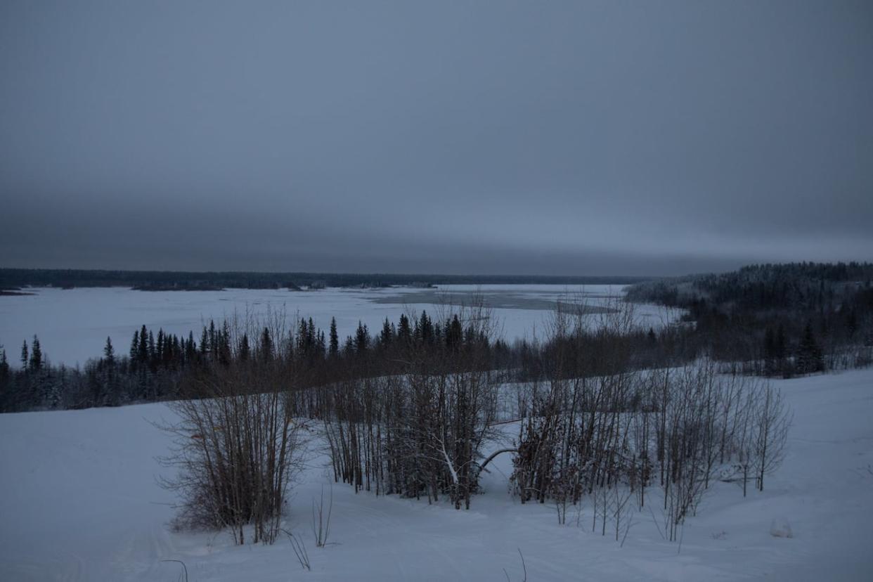 The Slave River runs through Fort Smith, N.W.T., on Friday. Mild weather has made for dangerous ice conditions on the river, says one local hunter. (Jason Franson/Canadian Press - image credit)