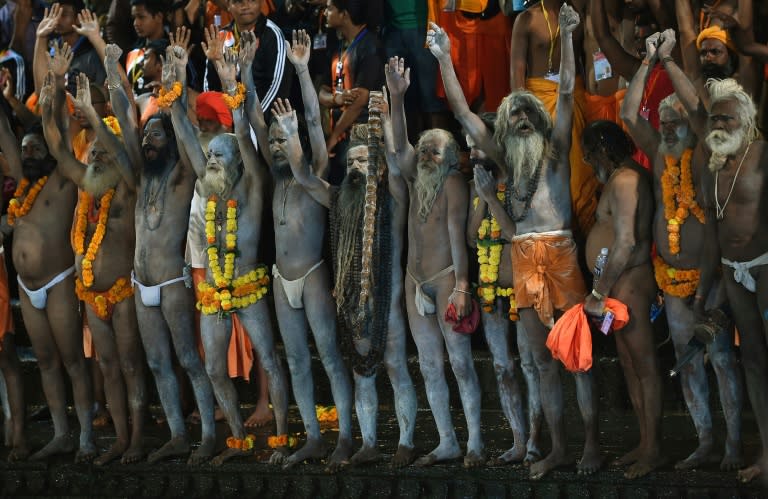 Indian Hindu holy men chant religious slogans as they prepare for the first holy dip at the Kumbh Mela in Trimbakeshwar near Nashik on August 29, 2015