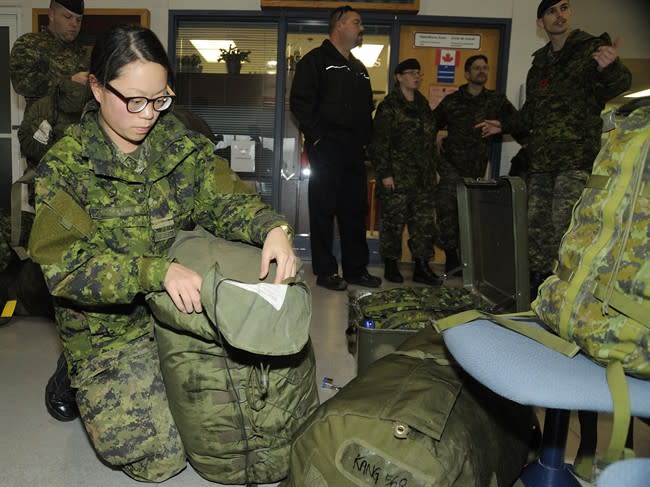 Lieutenant Alayna Kang of a Disaster Assistance Response Team (DART) prepares her luggage for a rapid deployment to the Philippine Islands on November 11, 2013. THE CANADIAN PRESS/HO, Canadian Forces Combat Camera - Corporal Darcy Lefebvre