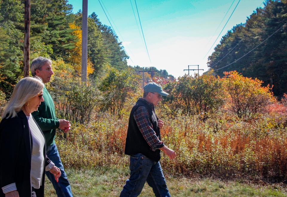 Fall River Water Department forester Michael Labossiere leads hikers along a fire road in the Southeastern Massachusetts Bioreserve on Wednesday, Oct. 19, 2022.