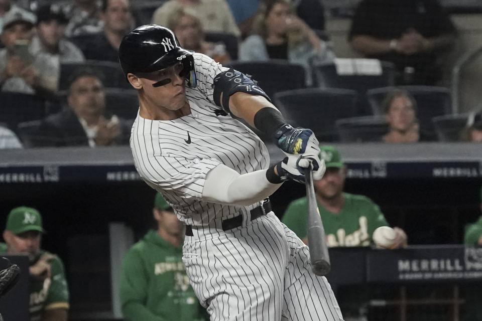 New York Yankees' Aaron Judge singles and scores a runner in the fifth inning of a baseball game against the Oakland Athletics, Monday, June 27, 2022, in New York. (AP Photo/Bebeto Matthews)