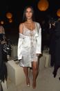 <p>In a Givenchy slip dress and robe at Paris Fashion Week.</p>