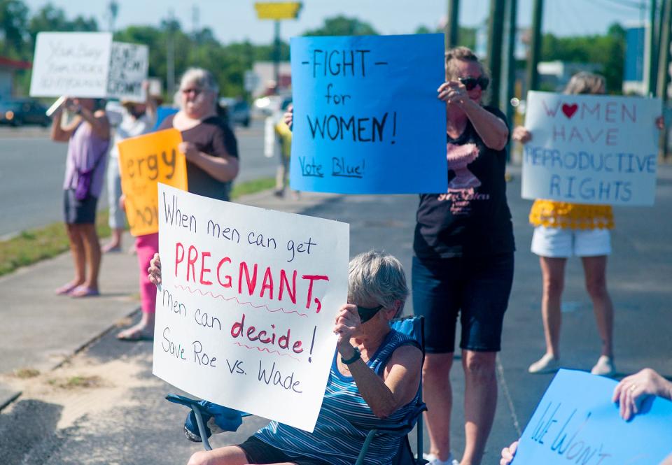 About 20 people gathered at John Sims Parkway and Government Avenue in Niceville on Wednesday in support of Roe v. Wade. The Democratic Women's Club of Okaloosa County organized the rally.