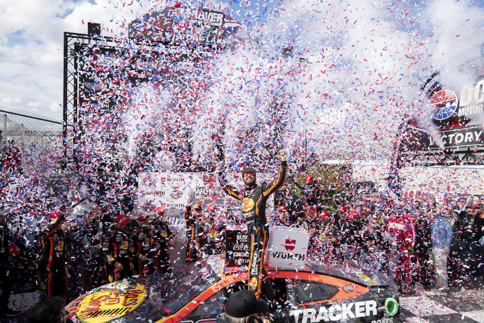 Martin Truex Jr., center, celebrates in Victory Lane after winning the NASCAR 400 auto race at Dover Motor Speedway, Monday, May 1, 2023, in Dover, Del. (AP Photo/Jason Minto)