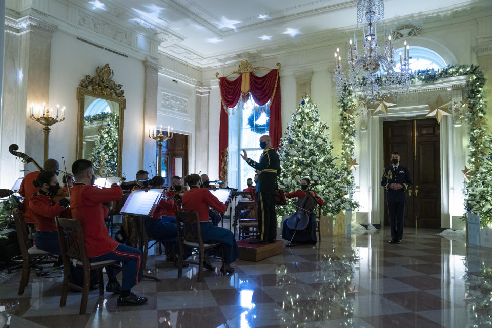 A Marine band plays Christmas music in the Grand Foyer of the White House during a press preview of the White House holiday decorations, Monday, Nov. 29, 2021, in Washington. (AP Photo/Evan Vucci)