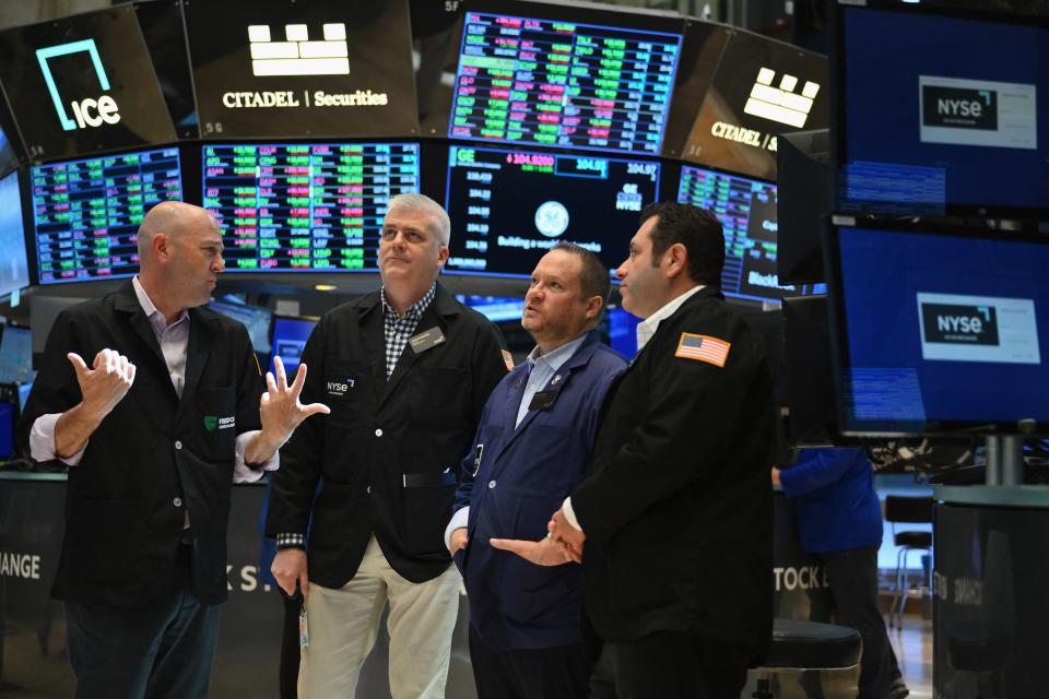 People work on the floor at the New York Stock Exchange (NYSE) in New York during the opening bell on May 22, 2023. Wall Street stocks were mostly higher early Monday ahead of afternoon fiscal talks between President Joe Biden and Republican leaders to avert a US debt default. (Photo by ANGELA WEISS / AFP) (Photo by ANGELA WEISS/AFP via Getty Images)