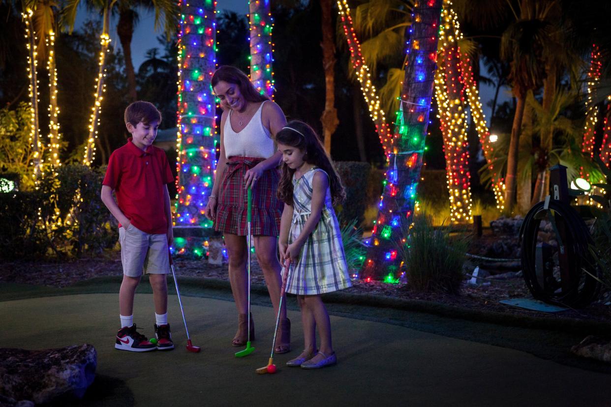 Mini golf under holiday lights is just one of the fun events at Cox Science Center and Aquarium's Winter Wonderland Laser Lights and Bites.