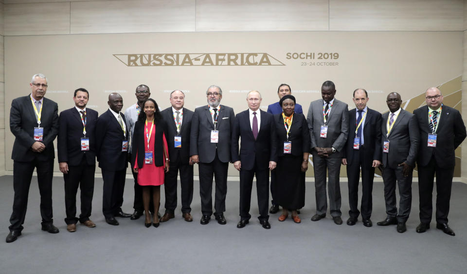 Russian President Vladimir Putin, center, pose for a photo with the heads of African news agencies on the sideline of Russia-Africa summit in the Black Sea resort of Sochi, Russia, Wednesday, Oct. 23, 2019. (Mikhail Metzel, TASS News Agency Pool Photo via AP)