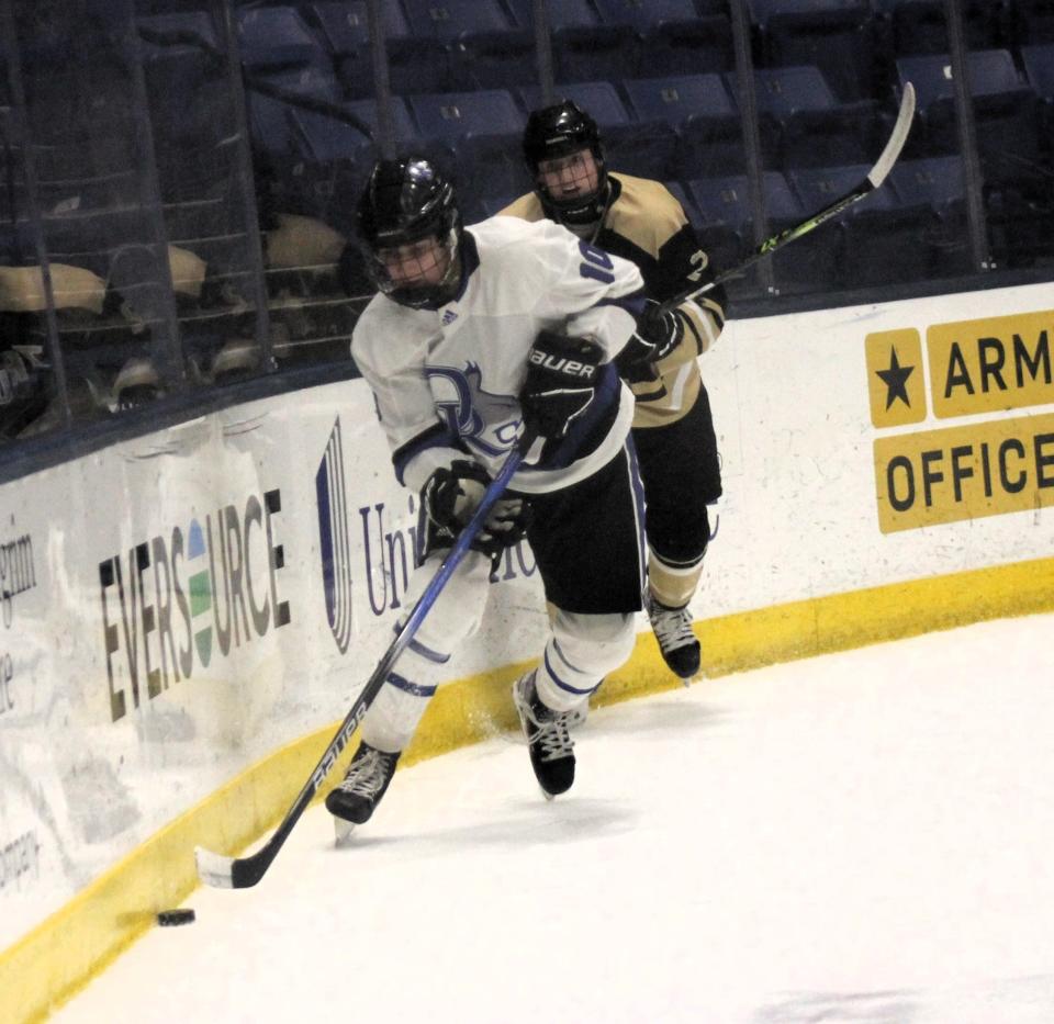 Oyster River's Liam Eddy has a step on Trumbull's August Metz during Thursday night's Heuchling & Swift  Memorial Classic at the Whittemore Center.