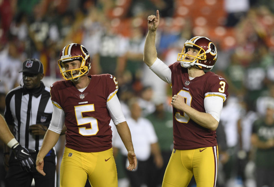 Washington Redskins' Dustin Hopkins (3) celebrates his game-wining field goal next to holder Tress Way (5) during the second half of a preseason NFL football game against the New York Jets, Thursday, Aug. 16, 2018, in Landover, Md. The Redskins won 15-13. (AP Photo/Nick Wass)