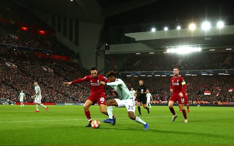 Kingsley Coman of Bayern Munich competes with Trent Alexander-Arnold of Liverpool during the UEFA Champions League Round of 16 First Leg match between Liverpool and FC Bayern Muenchen - Credit: GETTY IMAGES