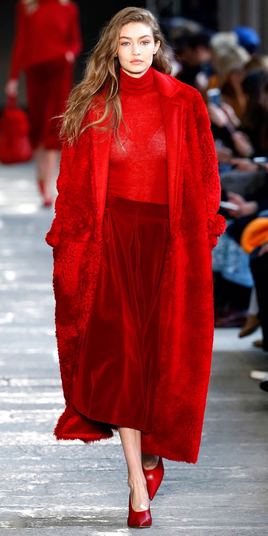 <p>Red is definitely having a moment at MFW, as Gigi was sent down the aisle at Max Mara in fire engine red from head to toe.</p>