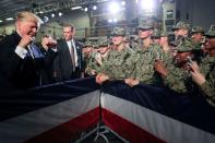 FILE PHOTO: U.S. troops take photos of U.S. President Trump aboard the USS Wasp in Yokosuka