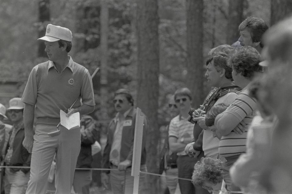 A golfer takes notes while taking notes on a green at the Augusta National Golf Course during the 1984 Masters. Mandatory Credit: