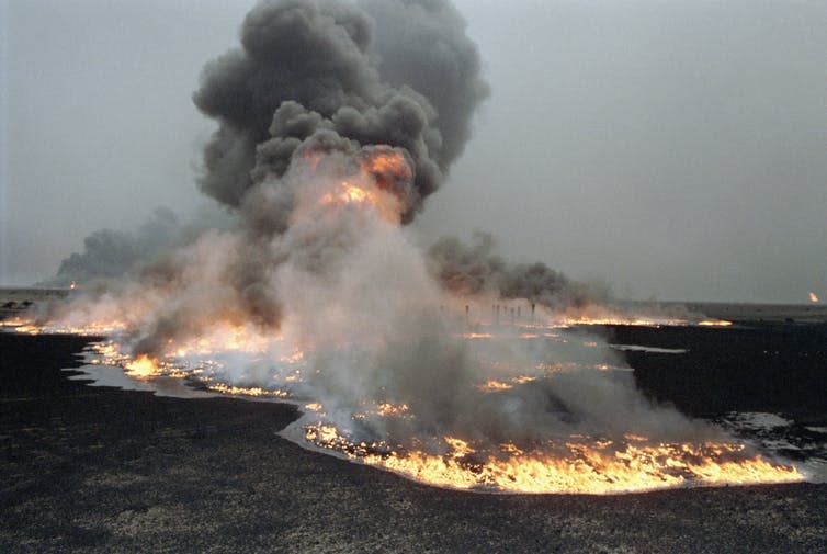 Fire burns in a field